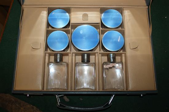 8-pce silver & blue guilloche enamel-mounted travelling toilet set with fitted mirror, in grey rexine case, London 1948